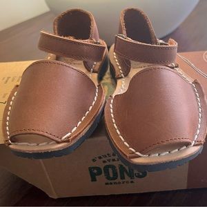 New, never worn, in box, with tags. Pons sandals. Kids size 7